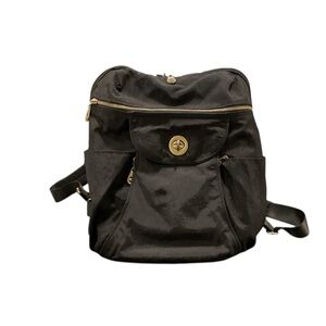Baggallini nylon Black Backpack with gold zippers and trim.